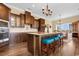 Island kitchen with granite countertops and dark wood cabinets at 3714 Old Pointe Circle, North Myrtle Beach, SC 29582