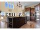 Spacious kitchen with granite countertops and dark wood cabinets at 3714 Old Pointe Circle, North Myrtle Beach, SC 29582