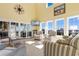 Sunlit living room with vaulted ceilings and water views at 3714 Old Pointe Circle, North Myrtle Beach, SC 29582