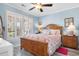 Bright bedroom with a wooden bed frame and flamingo bedding at 403 36Th Ave. N, North Myrtle Beach, SC 29582