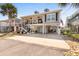 Two-story beach house with parking, elevated foundation, and American flag at 403 36Th Ave. N, North Myrtle Beach, SC 29582