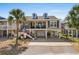 Two-story beach house with elevated foundation, garage, and spacious deck at 403 36Th Ave. N, North Myrtle Beach, SC 29582