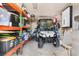 Garage with golf cart and storage shelves at 403 36Th Ave. N, North Myrtle Beach, SC 29582