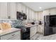 Updated kitchen featuring granite countertops and custom cabinetry at 403 36Th Ave. N, North Myrtle Beach, SC 29582