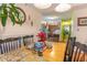 Bright dining room with kitchen view, wood table, and chairs at 4306 Princeton Dr., Little River, SC 29566