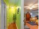 Light green hallway with wood floors and view of living room at 4306 Princeton Dr., Little River, SC 29566