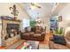 Cozy living room with stone fireplace and leather couches at 4306 Princeton Dr., Little River, SC 29566