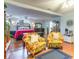 Main bedroom sitting area with two floral armchairs at 4306 Princeton Dr., Little River, SC 29566