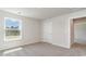 Well-lit bedroom with carpet, window, and access to hallway at 463 Acosta Circle, Conway, SC 29527