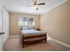 Cozy bedroom with a wooden bed frame and neutral color palette at 4637 Dogwood St., Loris, SC 29569