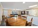 Dining area with a wooden table, chairs, and view into the living room at 4637 Dogwood St., Loris, SC 29569