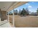 Front porch with white columns and a view of the yard at 4637 Dogwood St., Loris, SC 29569