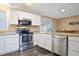 Kitchen with granite countertops and white cabinets at 4637 Dogwood St., Loris, SC 29569