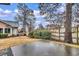 Private backyard with patio and mature trees at 4660 Lightkeepers Way # 37A, Little River, SC 29566