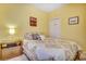 Bright bedroom featuring a double bed, nightstand, and window at 4660 Lightkeepers Way # 37A, Little River, SC 29566