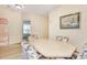 View of dining area with octagonal table and chairs, showing access to bathroom and other rooms at 4660 Lightkeepers Way # 37A, Little River, SC 29566