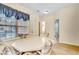 Casual dining area with octagonal table and chairs near the kitchen and bathroom at 4660 Lightkeepers Way # 37A, Little River, SC 29566