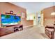 Living room with sectional sofa, recliner, and a view of the kitchen and dining area at 4660 Lightkeepers Way # 37A, Little River, SC 29566