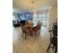 Charming dining area with wood table and chairs, near kitchen at 4811 Magnolia Lake Dr. # 105, Myrtle Beach, SC 29577