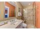 Bathroom with walk-in shower and orange walls at 4910 N Market St. # M9-R2, North Myrtle Beach, SC 29582