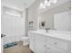 Simple bathroom with a white vanity, shower/tub combo and linen closet at 520 Shellbark Dr., Longs, SC 29568