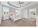 Bright bedroom with a white bed frame and ensuite bathroom access at 520 Shellbark Dr., Longs, SC 29568