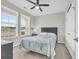 Cozy bedroom featuring a dark-wood bed frame and window seat at 520 Shellbark Dr., Longs, SC 29568