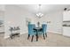 Charming dining area with teal chairs and a modern chandelier at 520 Shellbark Dr., Longs, SC 29568