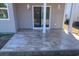 Back patio with flagstone-style flooring and sliding glass door access at 520 Shellbark Dr., Longs, SC 29568