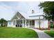 White community clubhouse with a metal roof and a large covered porch at 5353 Knobcone Loop # C-103, Myrtle Beach, SC 29577