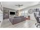 Relaxing living room with sectional sofa, built-in shelving, and large TV at 5353 Knobcone Loop # C-103, Myrtle Beach, SC 29577