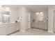 Double vanity bathroom with light gray cabinets and tile flooring at 554 Haven View Way, Murrells Inlet, SC 29576