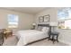 Bright bedroom with a comfortable bed, two windows, and nightstands at 554 Haven View Way, Murrells Inlet, SC 29576