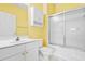 Clean bathroom with shower/tub combo and yellow walls at 5750 Oyster Catcher Dr. # 932, North Myrtle Beach, SC 29582