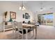 Bright dining area with wooden table and view of living room at 5750 Oyster Catcher Dr. # 932, North Myrtle Beach, SC 29582