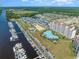 Aerial view of waterfront community with marina, pool, and buildings at 5825 Catalina Dr. # 1234, North Myrtle Beach, SC 29582