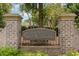 River Crossing community entrance sign, brick pillars, and landscaping at 5825 Catalina Dr. # 1234, North Myrtle Beach, SC 29582