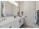 Modern bathroom with white vanity and a large mirror at 5913 Country Club Dr., Myrtle Beach, SC 29577