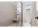 Bathroom with shower, toilet and built-in shelf at 5913 Country Club Dr., Myrtle Beach, SC 29577