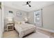 Bright bedroom with a queen-size bed and hardwood floors at 5913 Country Club Dr., Myrtle Beach, SC 29577