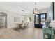 Bright dining area with black front door and hardwood floors at 5913 Country Club Dr., Myrtle Beach, SC 29577