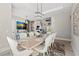 Elegant dining room with a large table, chandelier, and white chairs at 5913 Country Club Dr., Myrtle Beach, SC 29577