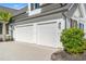 Two-car garage with white doors and landscaping at 5913 Country Club Dr., Myrtle Beach, SC 29577