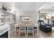 Casual dining area with white table and blue chairs at 6001 - 1861 S Kings Hwy., Myrtle Beach, SC 29575