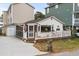 Quaint cottage with white siding, deck, and fenced yard at 6001 - 1861 S Kings Hwy., Myrtle Beach, SC 29575