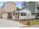 Quaint beach cottage with white exterior and deck at 6001 - 1861 S Kings Hwy., Myrtle Beach, SC 29575