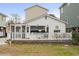 Charming cottage with white siding and a deck at 6001 - 1861 S Kings Hwy., Myrtle Beach, SC 29575