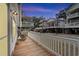 Charming front porch with rocking chairs, offering peaceful neighborhood views at 6001 - 1861 S Kings Hwy., Myrtle Beach, SC 29575