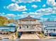 Elevated view of a two-story beach house with large deck at 6001 - 6004 S Kings Hwy., Myrtle Beach, SC 29575