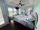 Bright bedroom with a queen bed, coastal decor, and access to a balcony at 6001 - 6004 S Kings Hwy., Myrtle Beach, SC 29575